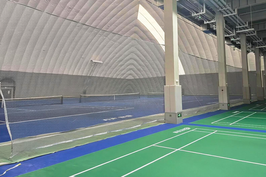 Badminton and tennis courts inside Weifang’s Floating Island sports dome